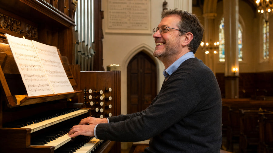Busy organist preparing festive music